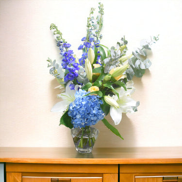 Bluesky Delight, Cylinder Vase Bouquet: Lily, Hydrangea, Creme Roses, Eucalyptus Touch